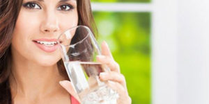 Woman drinking clean fresh water
